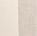 Gray and ivory reversible baby alpaca throw blanket styled in minimalist luxury living room