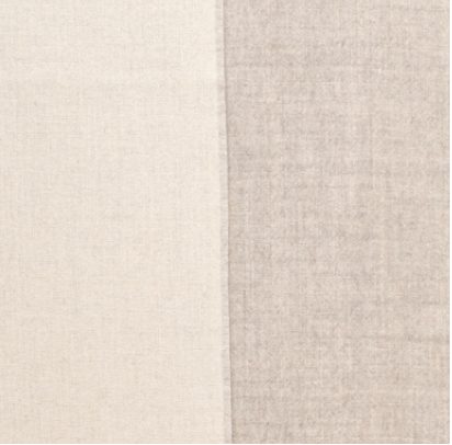Gray and ivory reversible baby alpaca throw blanket styled in minimalist luxury living room